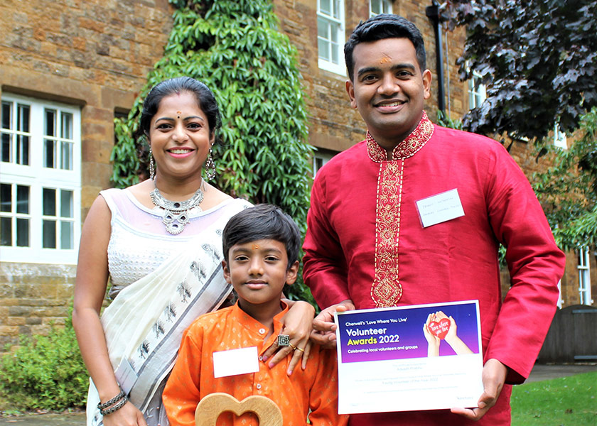 Advaith Prabhu, Prabhu Natarajan, Shipa Balachandran celebrate the Young Volunteer Award