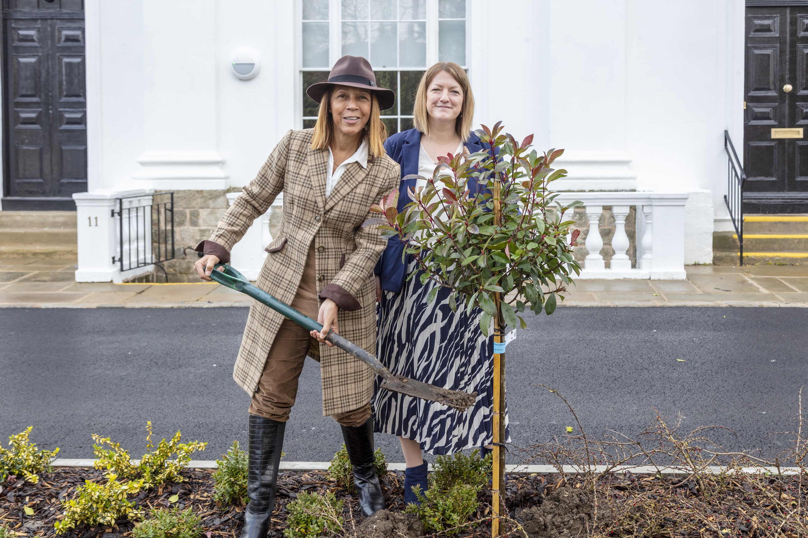 Helen Grant MP and Lizzie Hieron planting trees Helen Grant MP and Lizzie Hieron planting a small tree