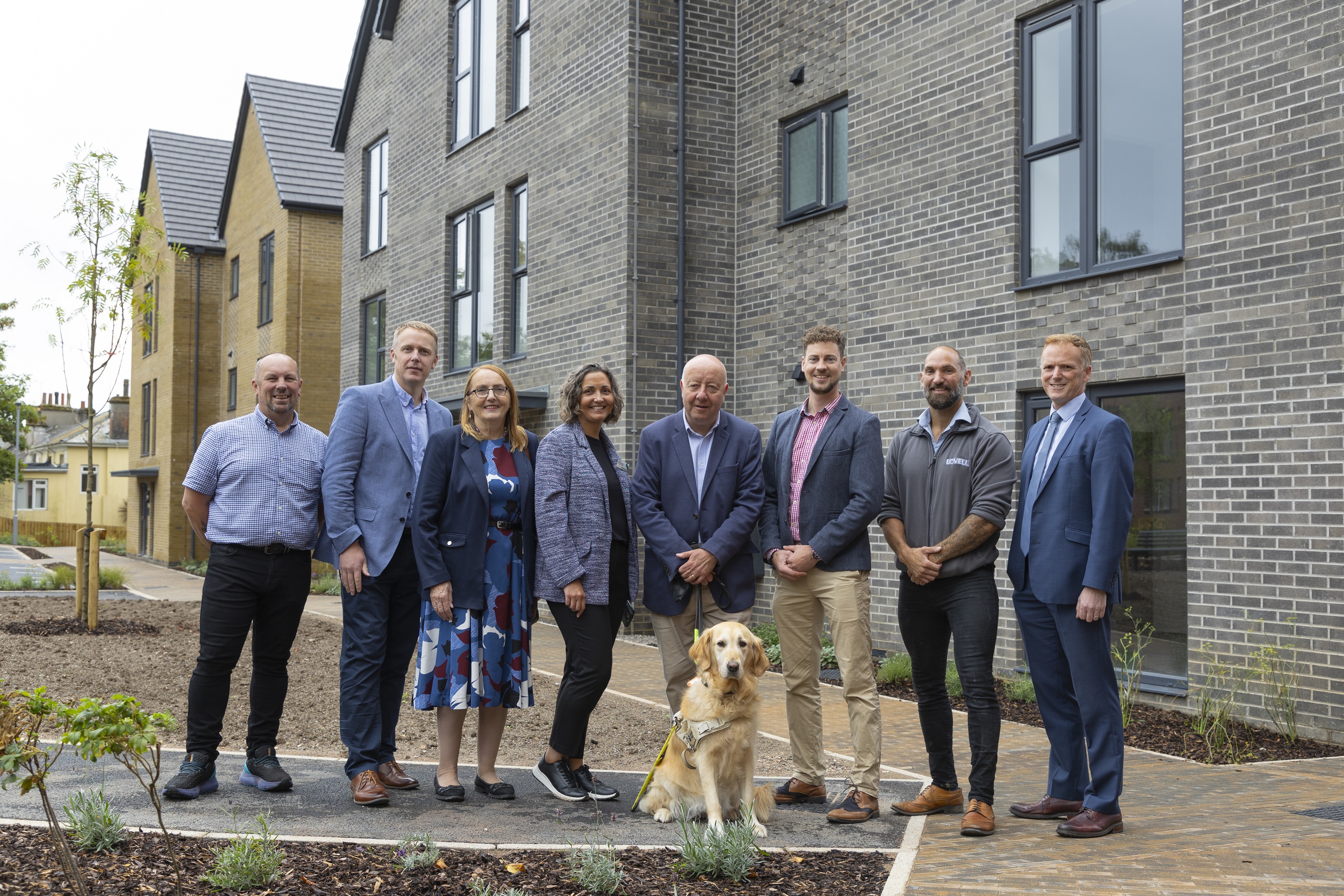 Mark Rowe - Assistant Site Manager, Lovell; Ross Field - Regional Managing Director, Lovell; Cllr. Hazel Foster; Claire Newcombe – Development Manager, Sanctuary; Steve Darling MP (with Jenny the dog); Matt Shaw - Operations Manager, Lovell; Sam Clarke - Site Manager, Lovell; Chris Cole - Development Director - England, Sanctuary standing in front needed new affordable homes for local people in Torquay.