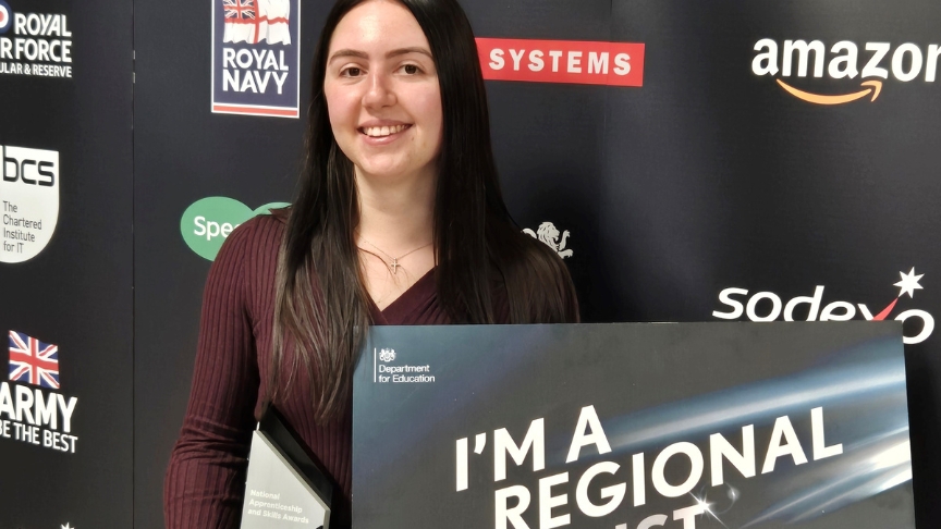 Regional finalist Katie at the awards ceremony holding her award