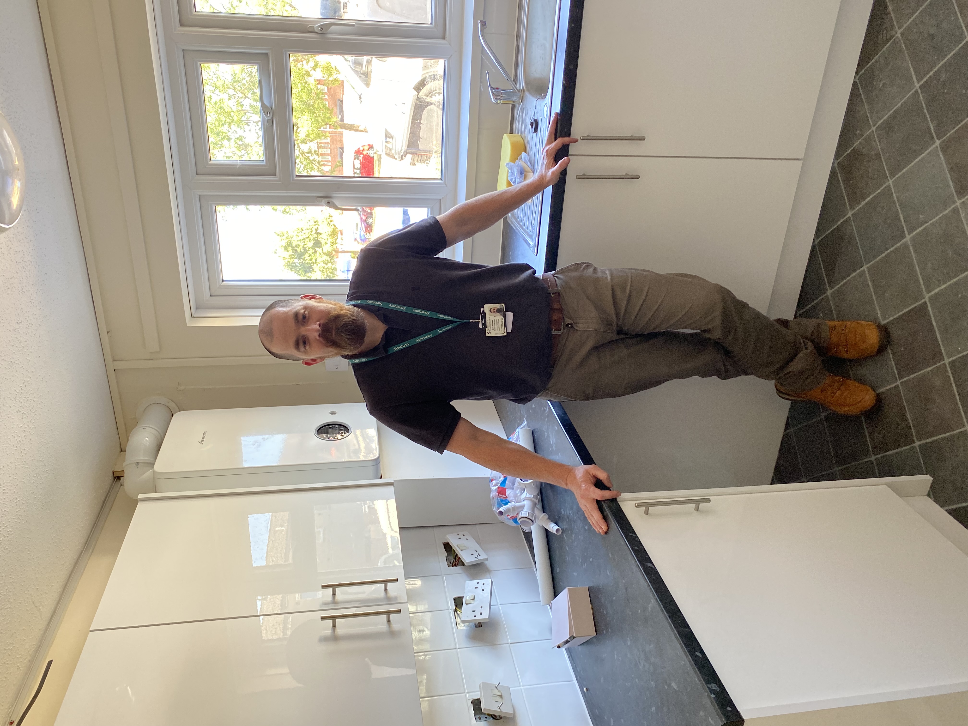 Chris a trade supervisor stood in front of a kitchen