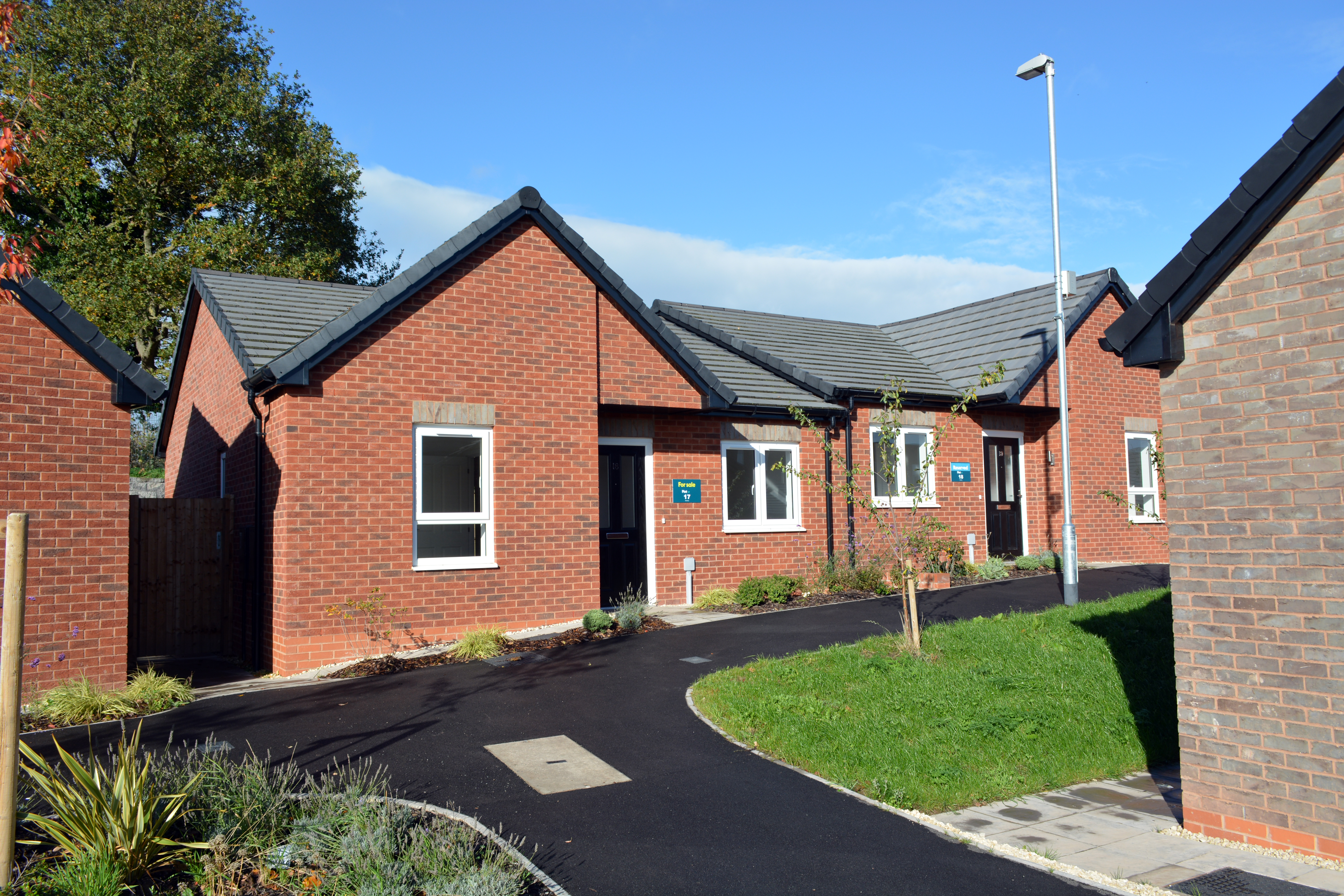 A red brick semi-detached bungalow
