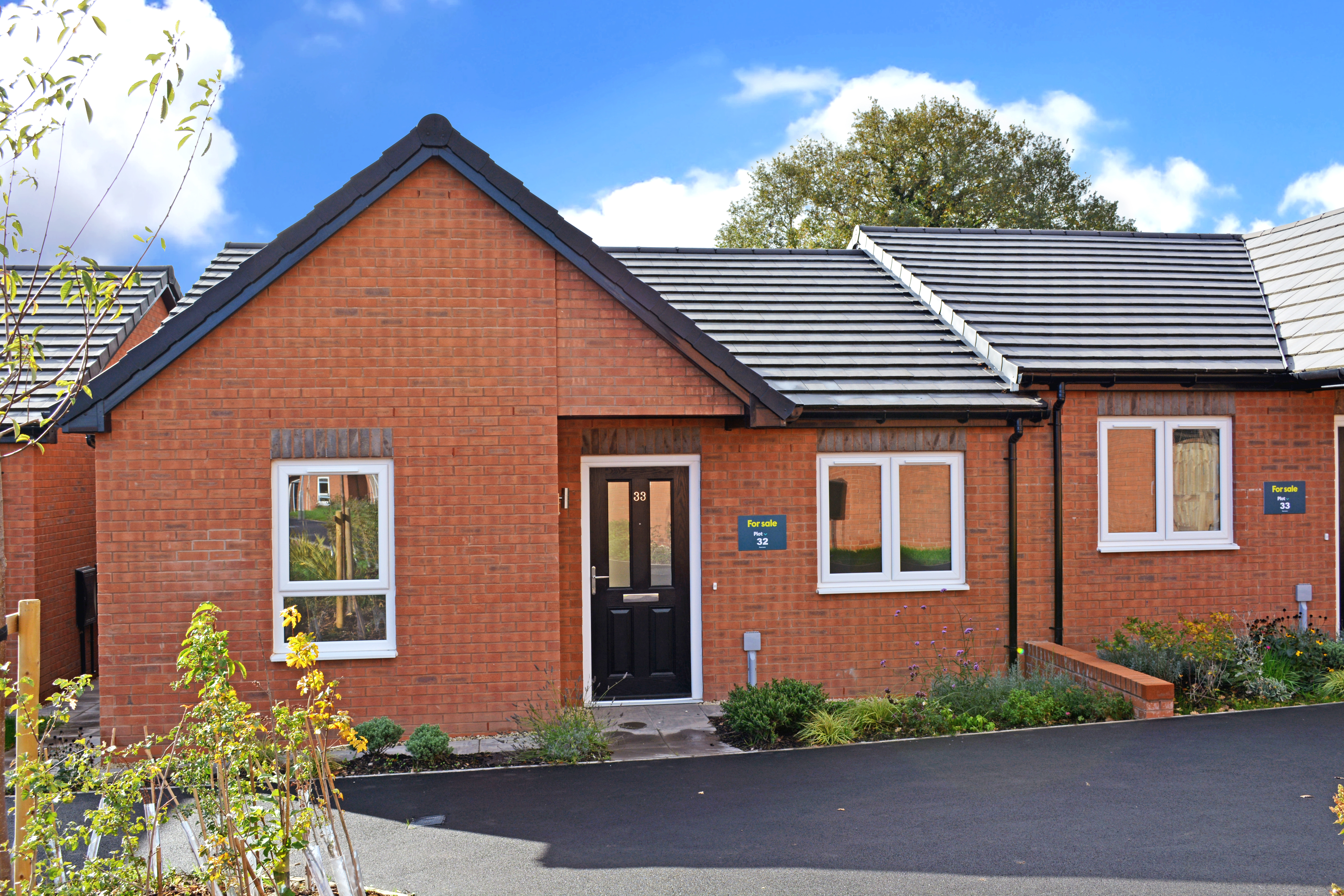 A red brick semi-detached bungalow