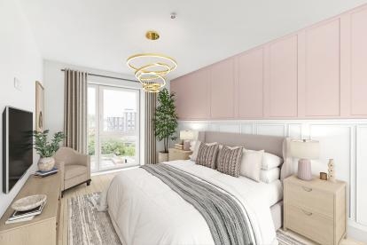 A modern bedroom coloured white and beige with pink accents, a wall mounted television sits opposite the bed 