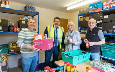 A image showing Gordon Hayes, Sanctuary's Tim Wray, Jenny Wray, Geoff Borgham at the food bank
