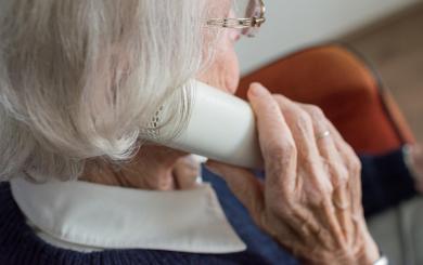 An elderly lady on the phone