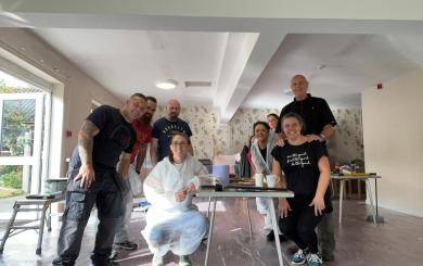 Sanctuary staff stand in a room that has recently been redecorated