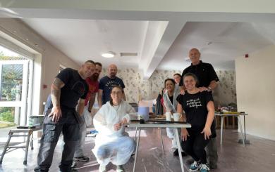 Sanctuary staff stand in a room that has recently been redecorated