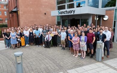 A large group of Sanctuary employees stood outside the head office in Worcester
