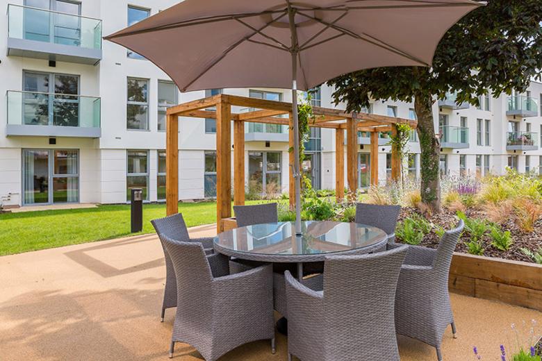 Outdoor seating patio area at New Court