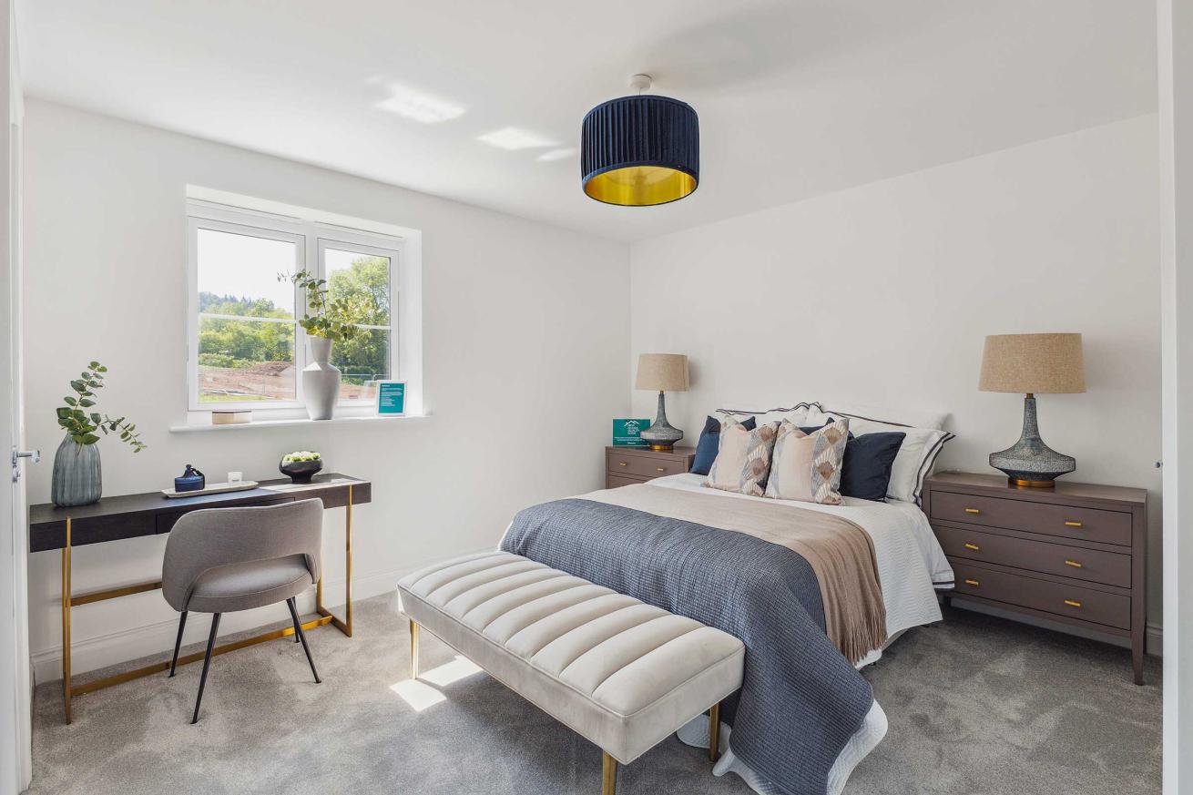  Large bedroom with double bed, desk, and en-suite bathroom.