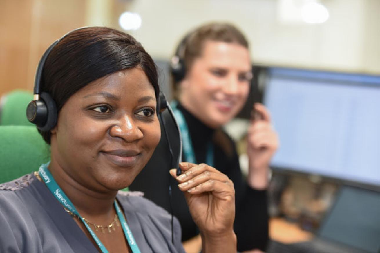 Two of Sanctuary's customer service team answering calls Two of Sanctuary's customer service team answering calls