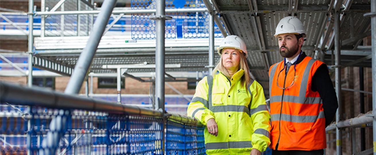 Sanctuary staff survey a building site