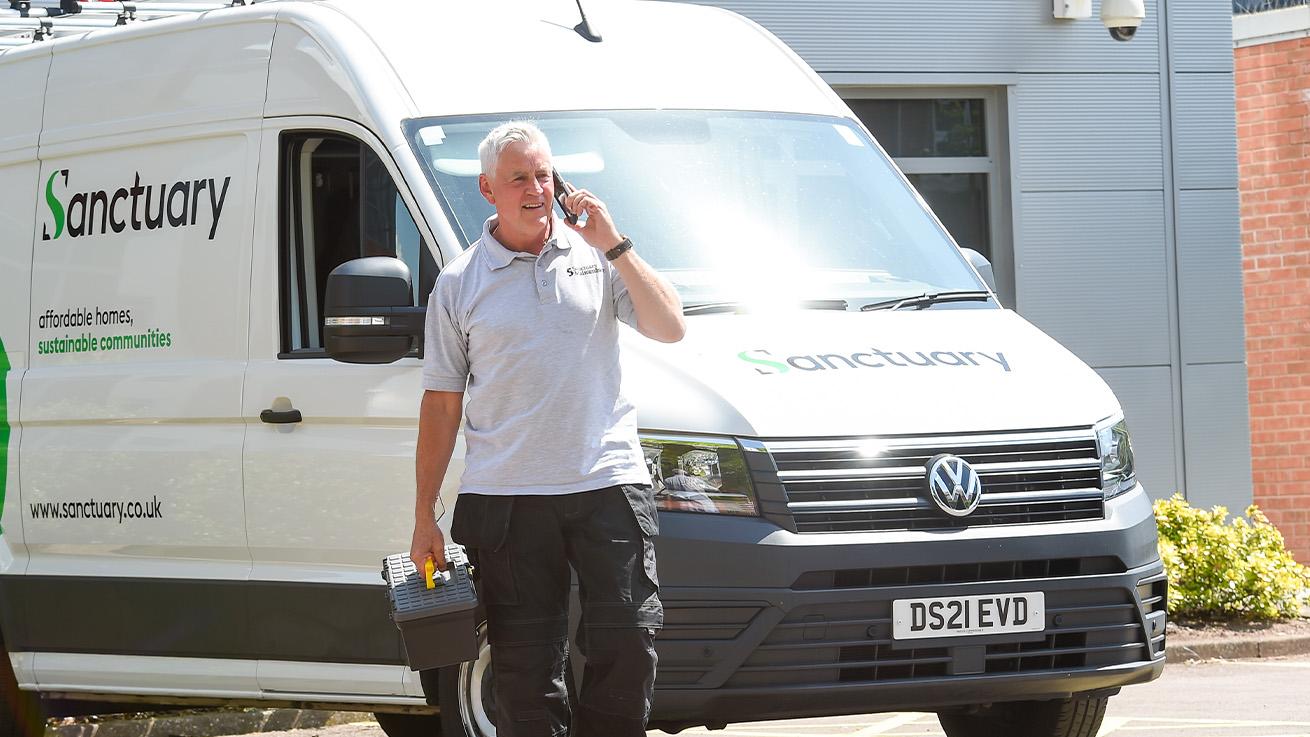 Man walking next to Sanctuary maintenance van