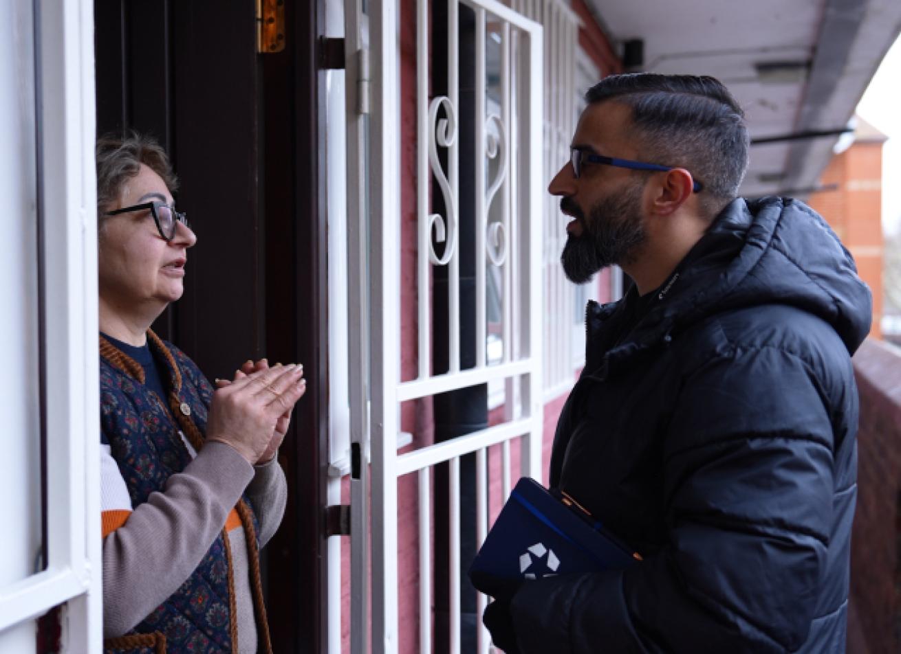 Community worker visiting a resident at their home.