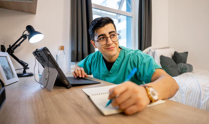 A keyworker studying within their accommodation. A keyworker studying within their accommodation.
