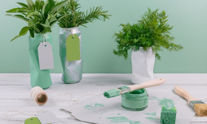DIY plant pots, green paint and a used paint brush