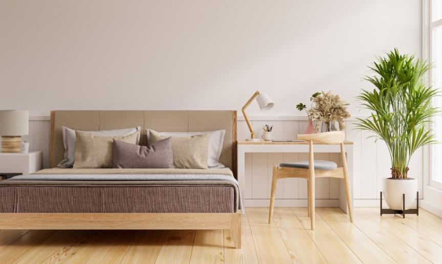 A modern, minimalistic bedroom decorated with beige tones