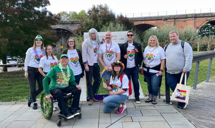 A group of employees of Sanctuary at Worcester Pride celebrations wearing Sanctuary branded Pride T-shirts