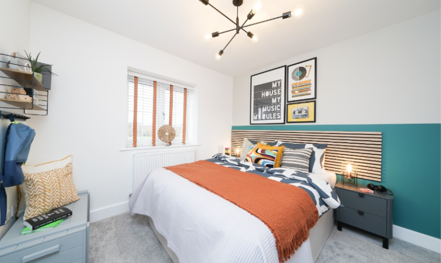 A brightly lit double bedroom finished with modern décor. 