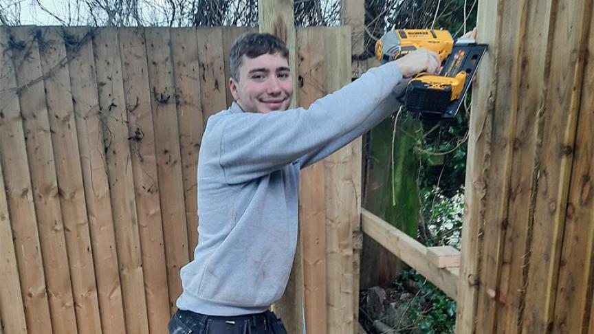A member of Sanctuary staff putting up new fences for the Acorn Community Centre A member of Sanctuary staff putting up new fences for the Acorn Community Centre