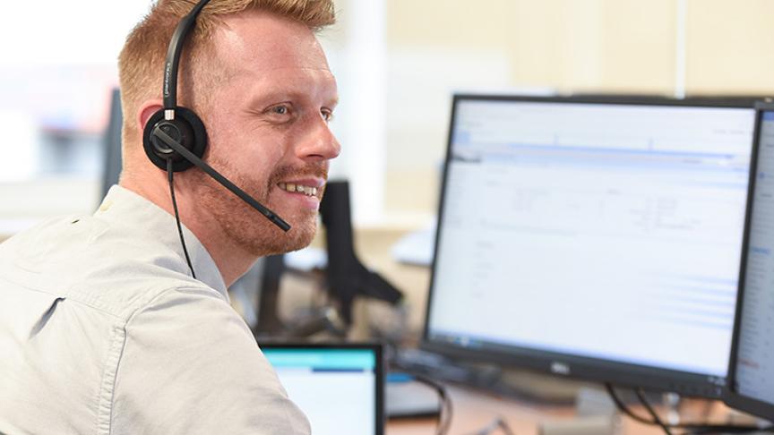Sanctuary staff member wearing a headset to answer calls Sanctuary staff member wearing a headset to answer calls