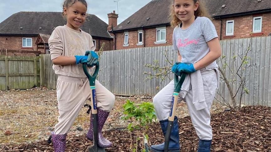 Malika and Tiyana Newey planting a tree at our Lache Growing Space Malika and Tiyana Newey planting a tree at our Lache Growing Space