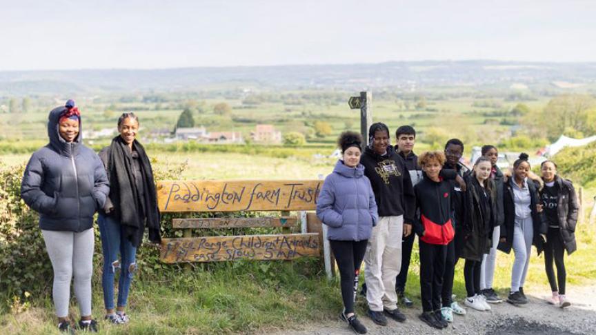 Hackney Youth Club lined up beside the Paddington Farm sign Hackney Youth Club lined up beside the Paddington Farm sign