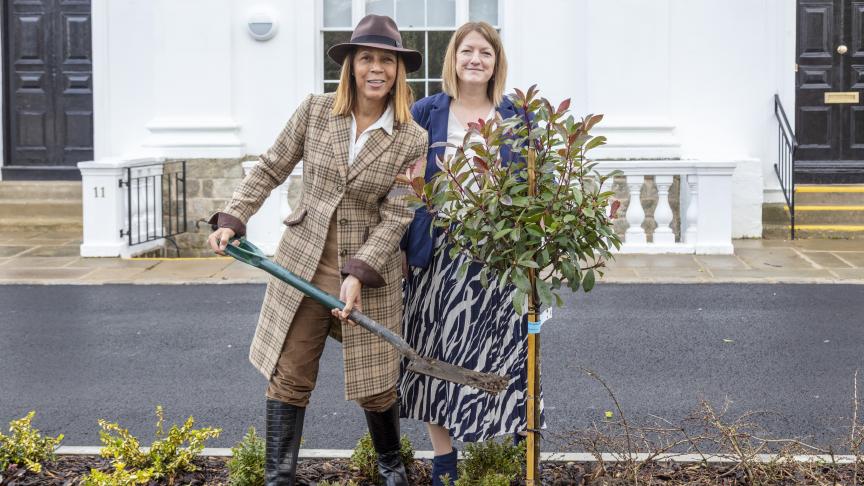 Helen Grant MP and Lizzie Hieron planting a small tree