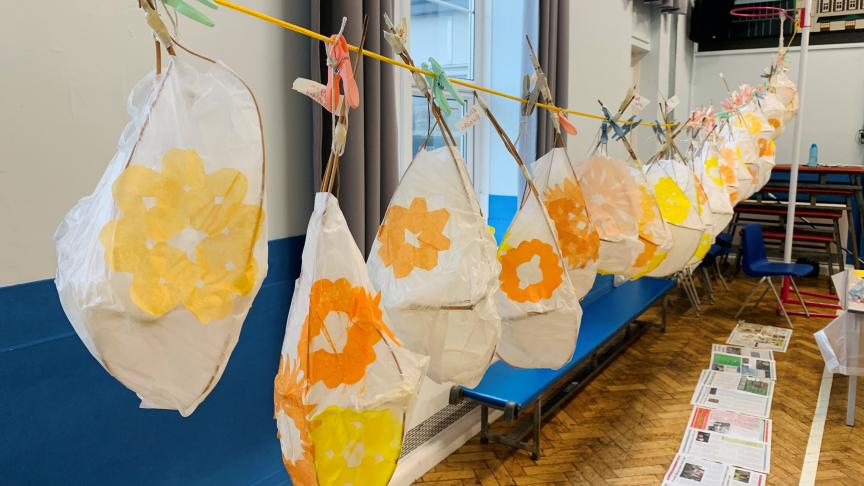 Handmade lanterns hang in a row