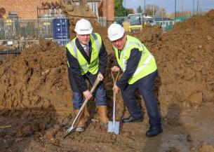 Rayleigh and Wickford MP Mark Francois and Craig Moule on the site of 100 new homes in Wickford wearing high vis and hard hats with spades digging into the ground