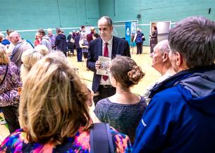 Members of the public gathering in an indoor hall to hear about Sanctuary's Laindon development plan