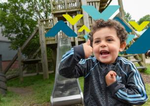 Child in Adidas jacket gives thumbs-up in front of playground slide, face blurred for privacy, with colorful geometric shapes overlaid.